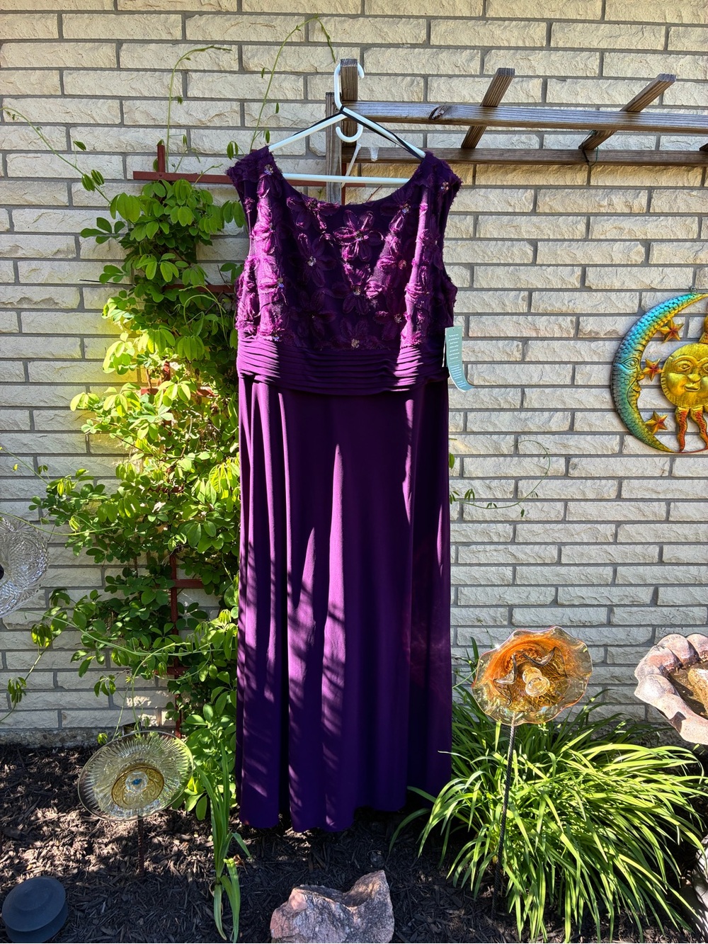 Brianna Milay elegant purple sleeveless evening gown